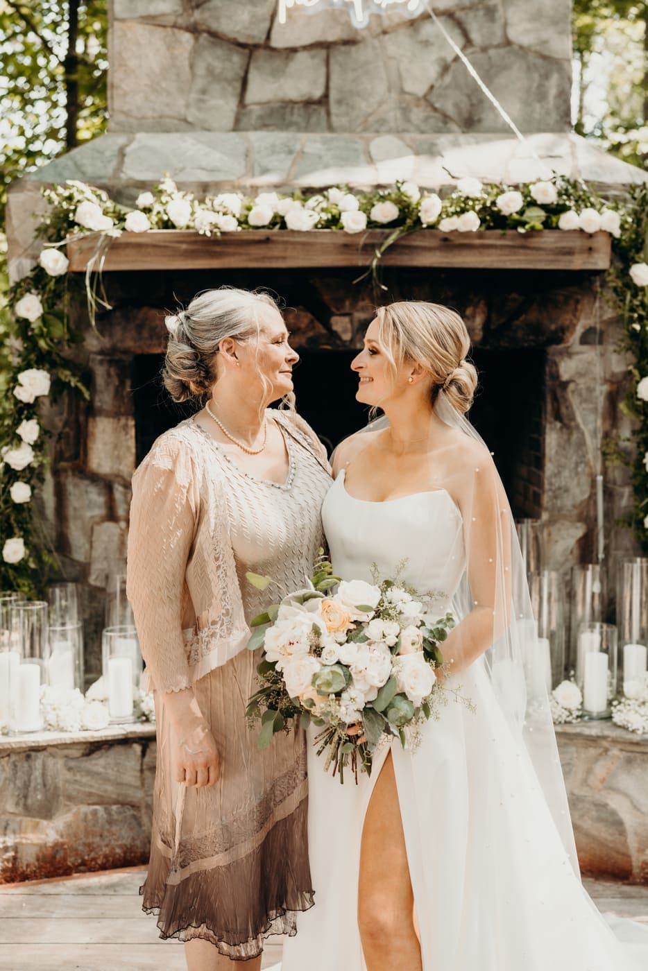 A bride and her mother, face to face before the ceremony.